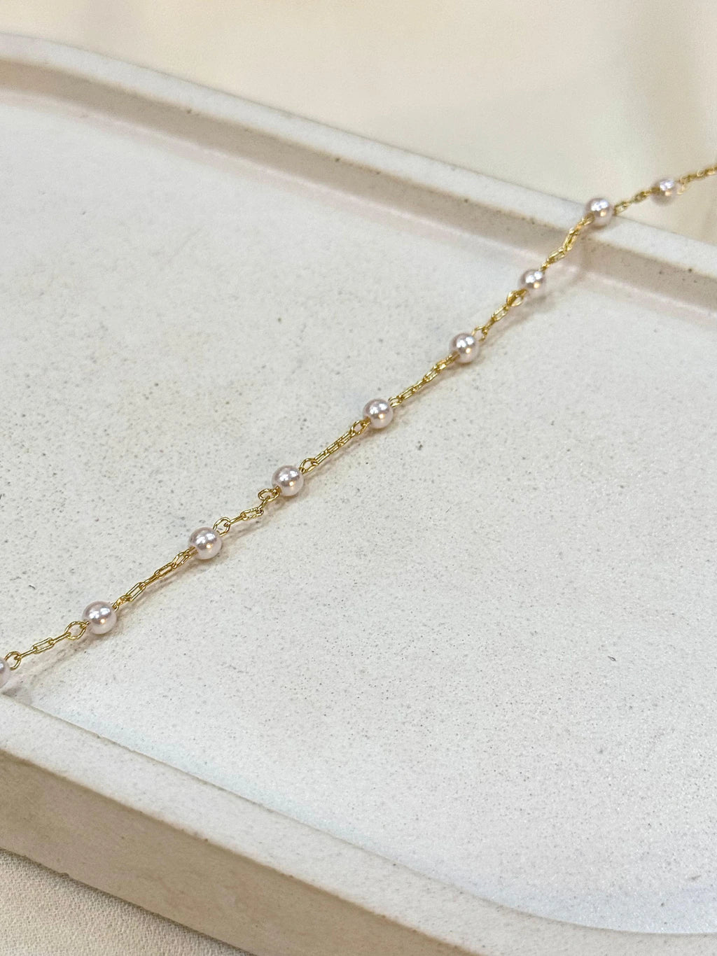 Pulseira mini pérolas