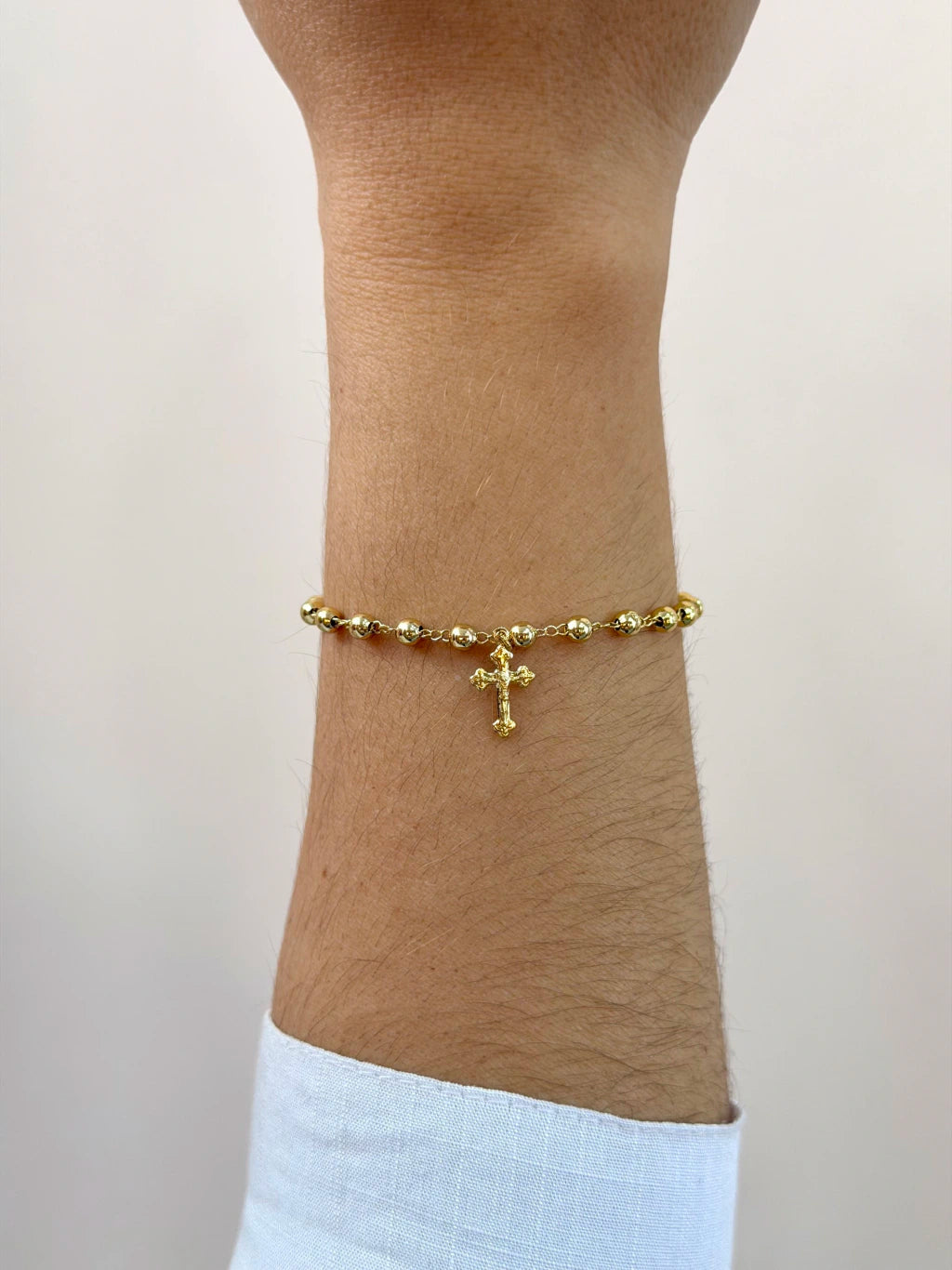 Pulseira bolinhas e cruz