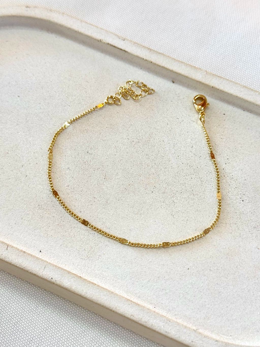 Pulseira grumet com chapinhas redondas